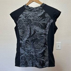 Hapari sleeveless, black floral rash guard